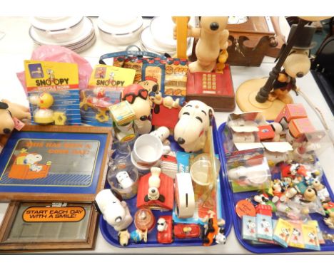 A collection of Snoopy memorabilia, to include a British Telecom telephone, a lamp base, boxed figures, keyrings, mugs etc.