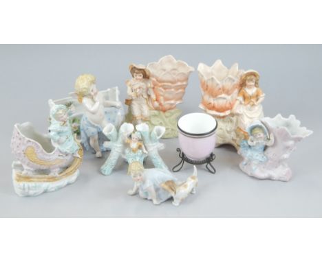 A collection of late 19thC German Continental porcelain, to include a Sitzendorf putti standing beside a crib etc.