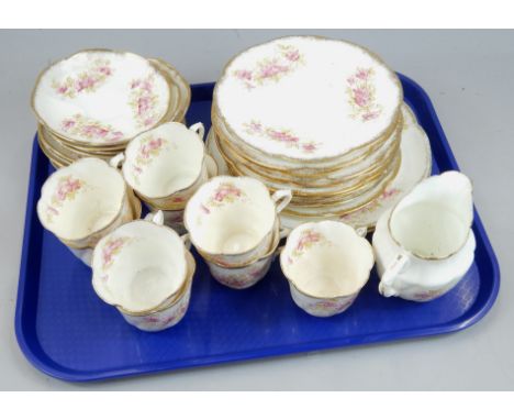 A Royal Albert porcelain part tea service, printed and painted with flowers and leaves etc., within gilt borders