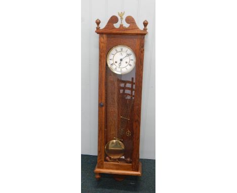 A 20thC wall clock, in oak case, with enamel style dial etc., 115cm high