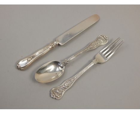 An American white metal christening set, comprising spoon, fork and knife, stamped Tiffany & Co Sterling