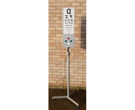 An optician's light, on retro style silvered metal adjustable stand, 192cm high.