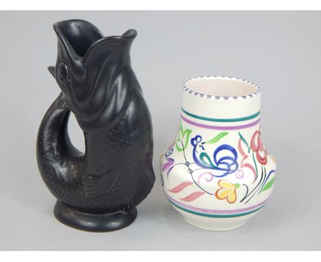 Two ceramic items, a Poole pottery vase decorated with a band of flowers etc., bearing initials to underside and a Dartmouth 