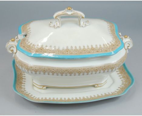 A Royal Worcester porcelain two handled tureen, cover and stand, decorated with a printed border in brown, with turquoise pai