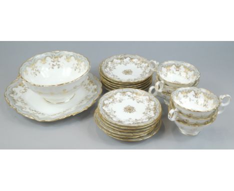 A late 19th/early 20thC Coalport porcelain part tea service, decorated in rococo style with grey borders, picked out in gilt,