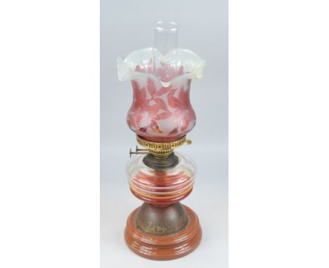 A late 19th/early 20thC oil lamp, stamped Duplex, made in England, the acid typed etch shade decorated with flowers, with cle