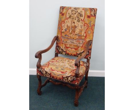 A late 19thC / early 20thC Continental walnut open armchair, with tapestry covered padded back and seat, depicting musicians,