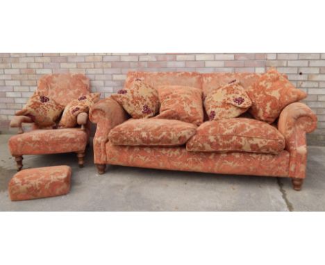 A good quality Victorian style two seat sofa, upholstered in orange and brown floral fabric, on turned legs, and a matching o