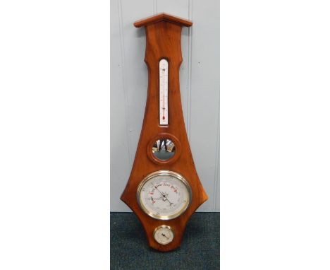 A Shortland Bowen aneroid barometer, in a yew case, 18cm high
