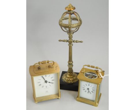 A French brass carriage timepiece, with enamel dial, an oil lamp or desk lighter base cast in the form of a Victorian lamp po