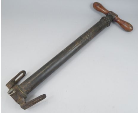 A Dunlop brass pump, with turned wood handles etc., 54cm long
