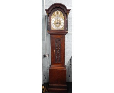 Simon Thorne, London.  A longcase clock, the arched dial with silvered chapter ring, date aperture and seconds hand with stri