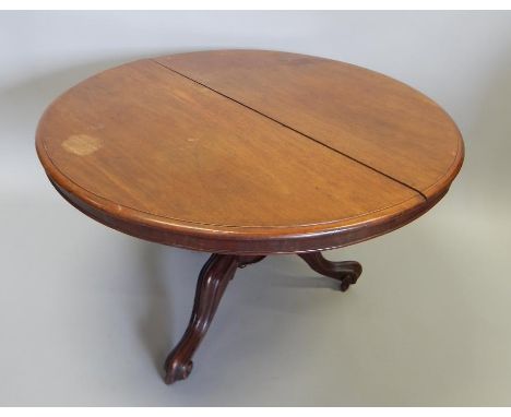 A Victorian mahogany dining table, the circular tilt top on a turned column and tripod base, 126cm dia.