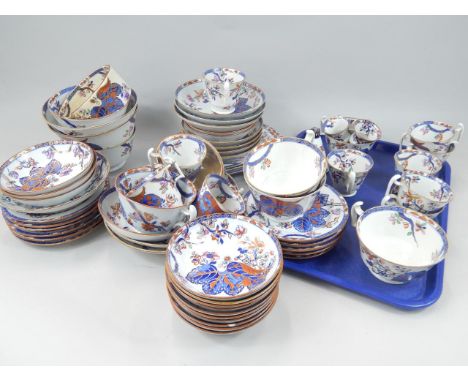 A large quantity of 19thC Copeland and Spode tobacco leaf pattern dinner and tea ware, to include small meat dishes, cups sau