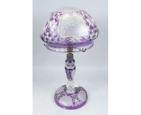 A 20thC Bohemian type purple flash lamp base, with domed shade and shaped foot, with gilt metal mounts, 46cm high