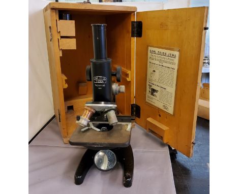 A 20th-century black monocular microscope, by Carl Zeiss, Jena, no. 297189, rack and pinion adjustment, sub-stage condenser, 