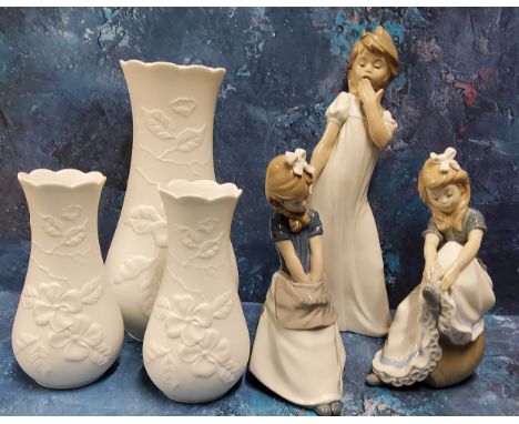 A Nao figure, of a girl, yawning, 30cm high, printed mark;&nbsp; others;&nbsp; &nbsp;a large Kaiser vase, in relief with flow