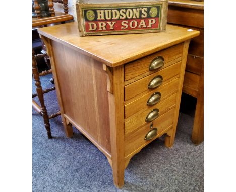 An early 20th century light oak deep bank of five drawers, brass cup handles stamped 'GR' for Georgius Rex, Arts &amp; Crafts