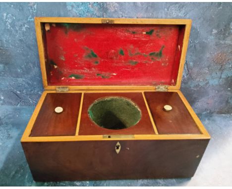 A large George III mahogany rectangular tea caddy, the interior with central mixing bowl aperture flanked by two lidded compa