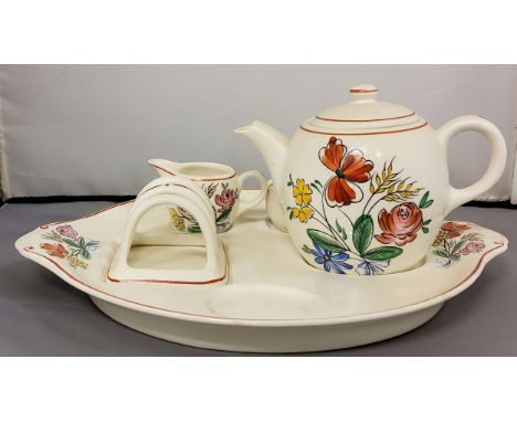 A Grays Pottery breakfast set, possibly designed by Susie Cooper, comprising a teapot, milk jug, and sugar bowl, each decorat