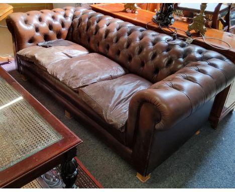 A three seater Chesterfield sofa (later wooden feet) 