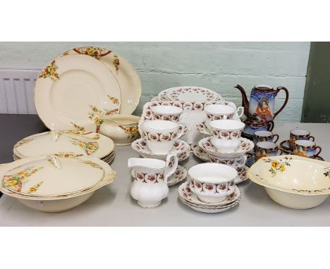 A Grindley Cream petal pattern part dinner service, printed with flower tendrils, printed marks, c.1930;&nbsp; a Winalex Ware