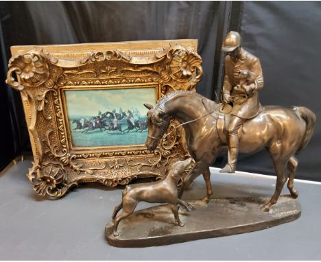 A bronzed model, of a huntsman and hounds. 30cm high;&nbsp; a decorative&nbsp; picture, of a Steeple Chase, gilt frame (2) 