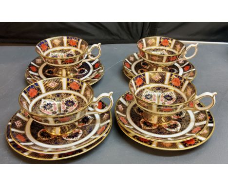 A set of four Royal Crown Derby 1128 pattern pedestal teacups and saucers, printed marks 