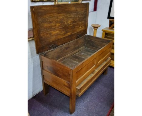 A 19th century light oak housekeeper's chest, the hinged top revealing panelled storage, fielded panelled front holding one l