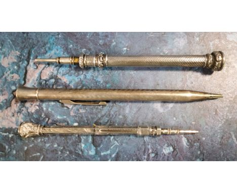 A silver sliding pencil, engine turned, 12.5cm long;&nbsp; others (3) 