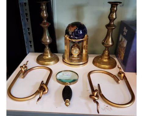 Four gilt metal curtain tie-backs;&nbsp; a brass ejector candlestick;&nbsp; a table top specimen globe;&nbsp; a magnifying gl