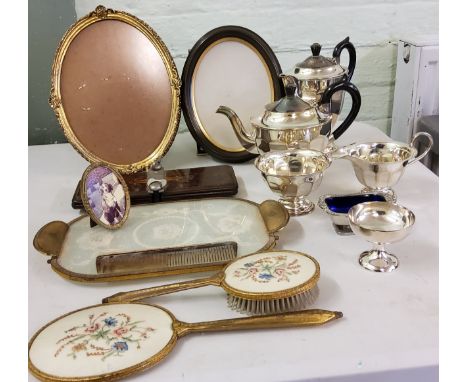 A four-piece E.P.N.S. tea service, paneled sides, c.1940;&nbsp; a gilt metal mounted dressing table set;&nbsp; various frames