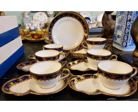 A set of six Aynsley teacups and sandwich saucers,&nbsp; five further saucers and three side plates,&nbsp; each banded in cob