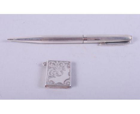 A silver pencil and a silver stamp case