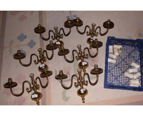 Six matching two-light Dutch design brass wall lights