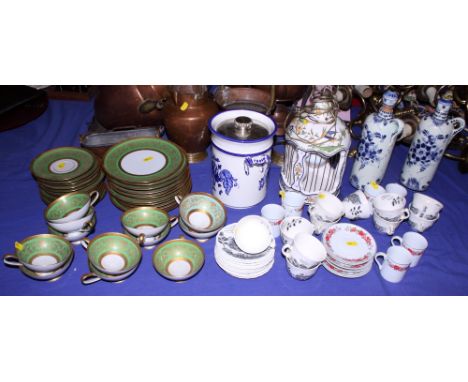 A German green and gilt part combination service, a collection of coffee cups and saucers, "The Thames at Sonning Bridge" and