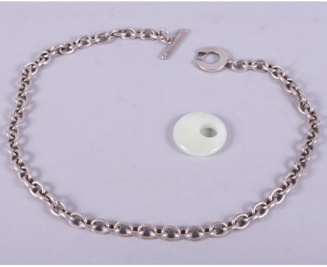 A T-bar necklace, inscribed Tiffany &amp; Co, and a jade pendant