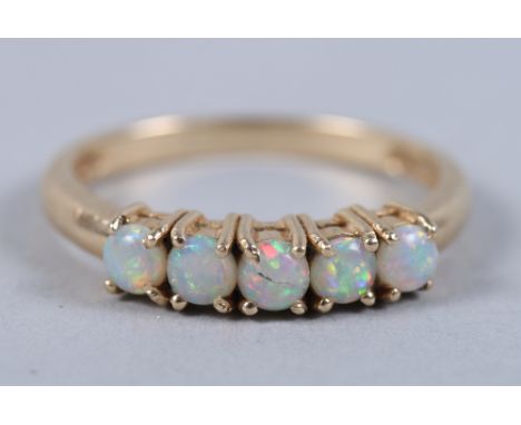 A 14ct gold five stone opal ring, size N, 2.2g (damages)