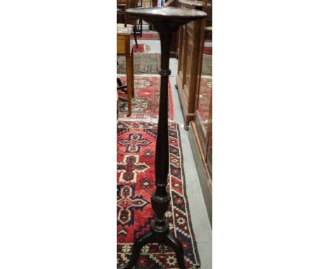 A mahogany torchere stand, on tripod splay supports, and a carved oak wall shelf