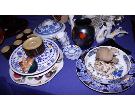 A Japanese porcelain charger, a similar bowl, a blue and white decorated part coffee set, a Poole pottery vase, a figure grou