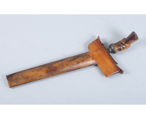 An Indonesian kris with hardwood scabbard and handle, blade 8" long