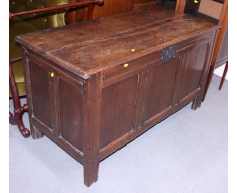 An 18th century oak triple panel front coffer, on stile supports, 48" wide