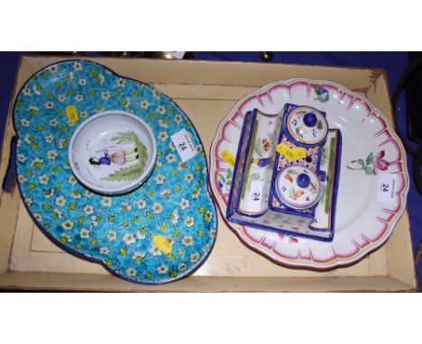 A Quimper ink stand, a nut dish, a floral decorated plate and a lobed dish