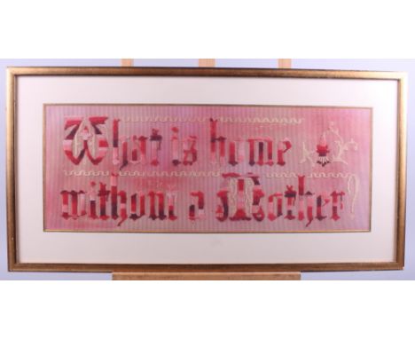 A 19th century embroidered / woolwork verse panel, "What is home without mother", 8" x 21", in gilt frame
