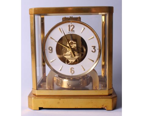 A Jaeger-LeCoultre Atmos clock in brass and glass case, 9 1/4" high