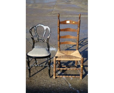 A rush seat ladder back chair, on bobbin turned supports, and an ebonised and mother-of-pearl inlaid side chair