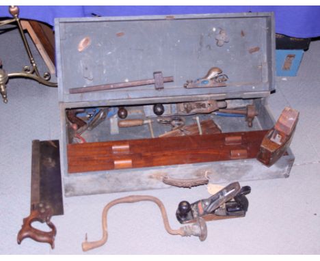 A cabinet maker's tool chest, containing saws, planes and other tools