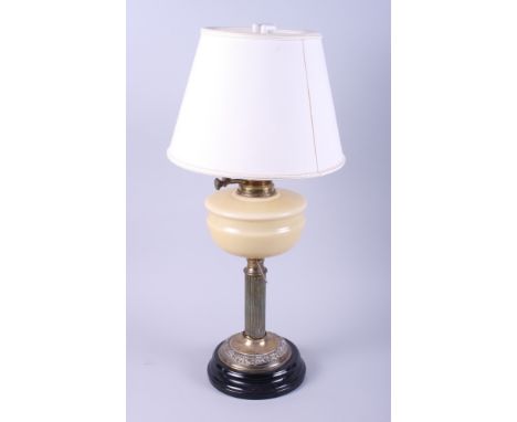 A brass and milk glass oil table lamp with reeded column (now converted to electricity)