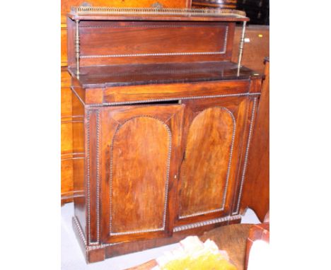 A mid 19th century rosewood chiffonier with raised back and shelf over two doors, on block base, 36" wide