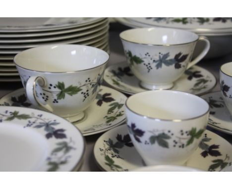 A LARGE COLLECTION OF ROYAL DOULTON 'BURGUNDY' PATTERN TEA AND DINNERWARE, comprising 12 tea cups, 12 saucers, 8 coffee cans,